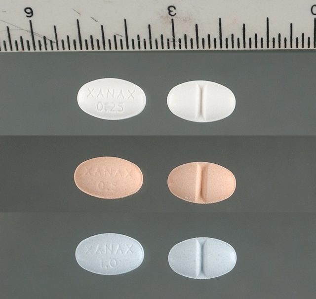 Xanax (alprazolam) 0.25 mg, 0.5 mg and 1 mg tablets, shown with a ruler